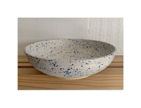 Blue speckled and matte white serving bowl