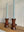 One tier short dark ketchup candle stick holders